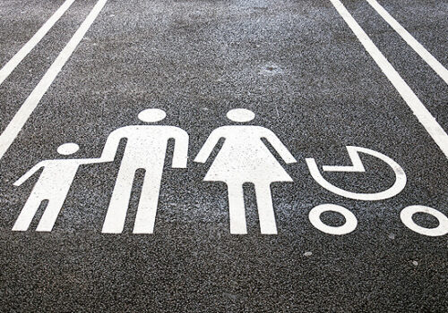 parking spot with family stick figures on it