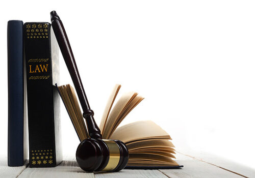 law books and a gavel sitting on a table