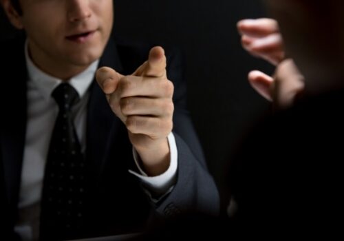 A Criminal Defense Lawyer in East Peoria IL speaking with a prosecutor