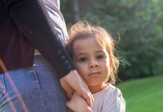 Father holding the hand of his daughter during dispute over child custody in Peoria IL