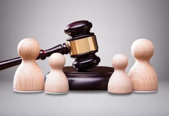 Wooden figures with a gavel in between them, representing Child Custody Lawyers in Peoria IL