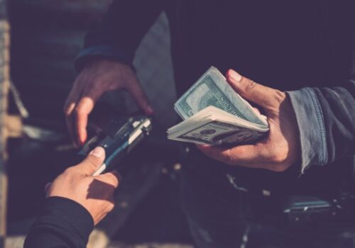 A man illegally purchasing a firearm, one of many Gun Crimes in Peoria IL