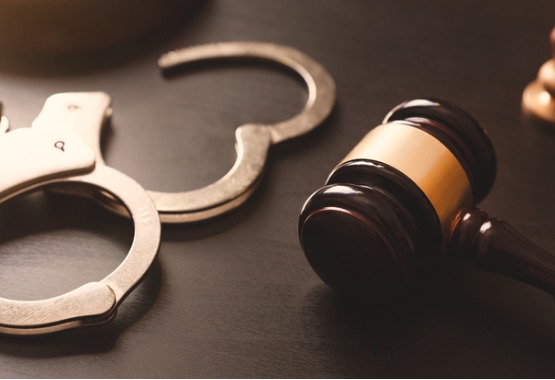 Sexual Solicitation with handcuffs and gavel in Peoria IL