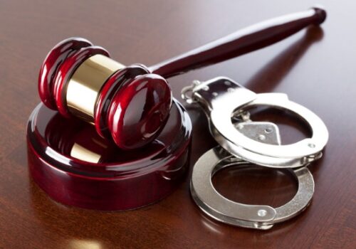 Sexual Solicitation in East Peoria IL with handcuffs and gavel