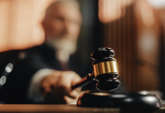 A judge hits his gavel, representing Juvenile Law in Dunlap IL