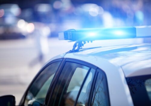 The flashing lights of a police car represent the need for a Juvenile Lawyer in Peoria IL