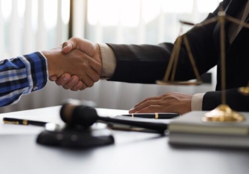 A handshake between a person and his Defense Attorney in Pekin IL illustrates how easy it is to hire an attorney for your case